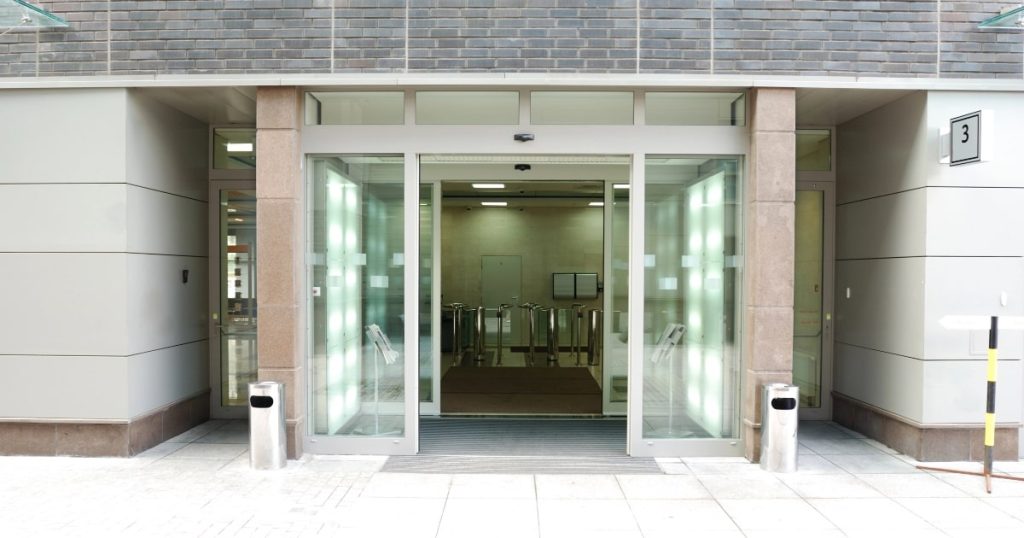 Business entrance with automatic sliding doors.