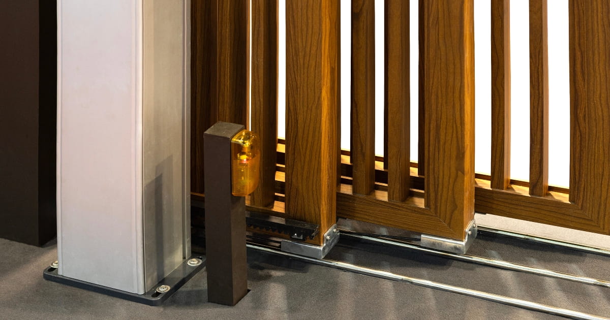 Automatic telescopic gate panels with a safety warning light.