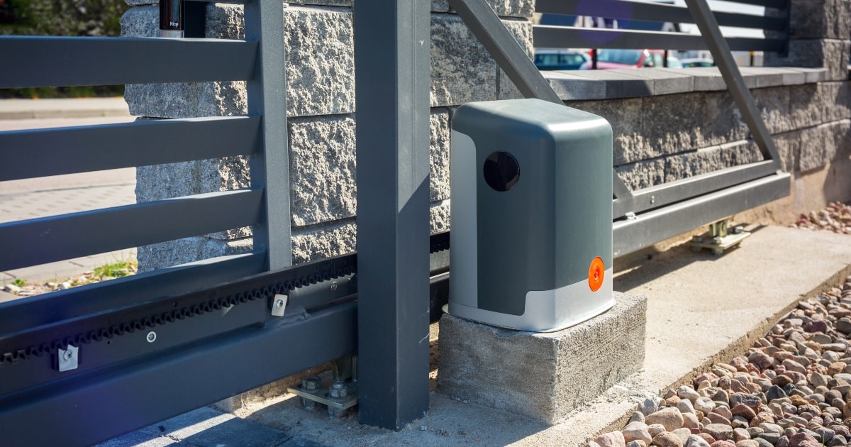 Automatic gate operator controlling a modern horizontal-slat security gate.